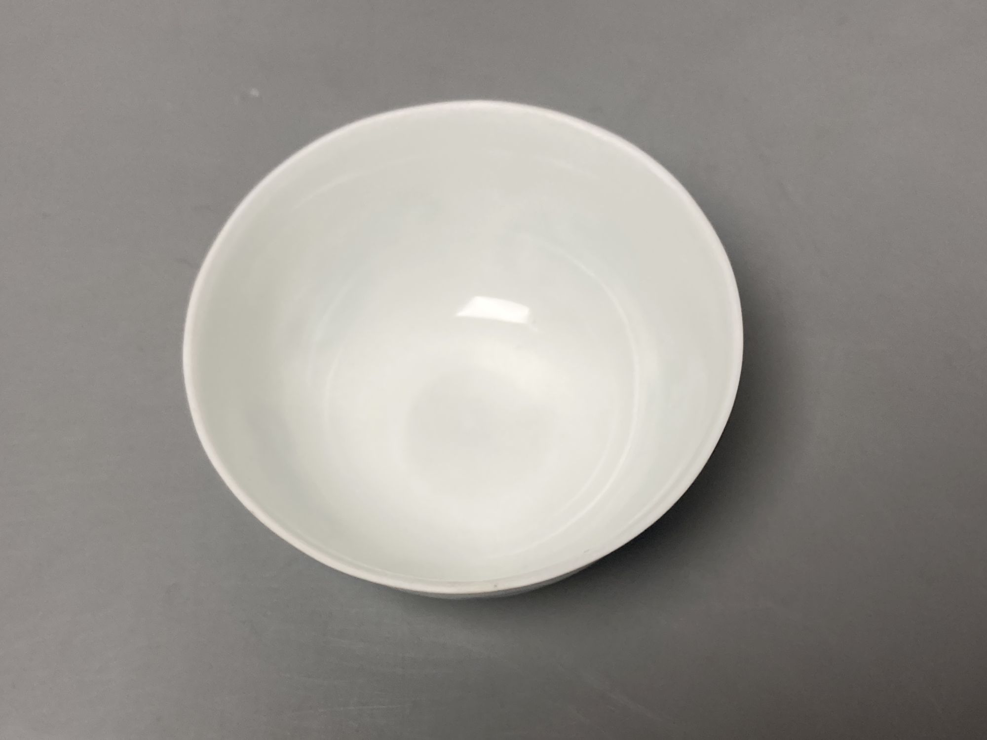 A Chinese blue and white 'five bat' tea cup, Kangxi mark but later, diameter 8cm